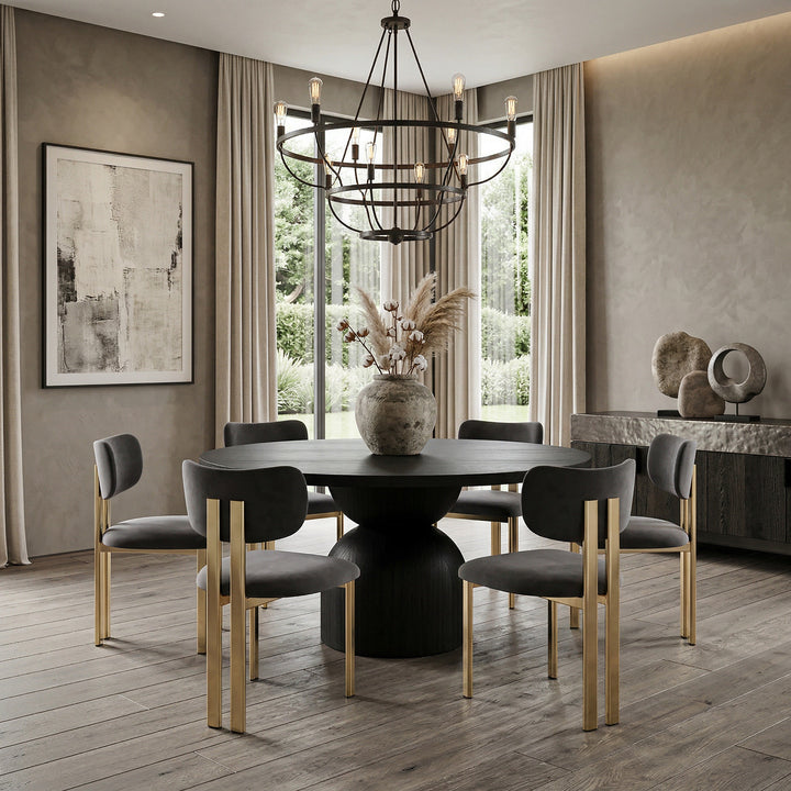 Black velvet Claudio dining chair with sleek design, featuring a rounded backrest and metal legs, ideal for modern dining spaces.