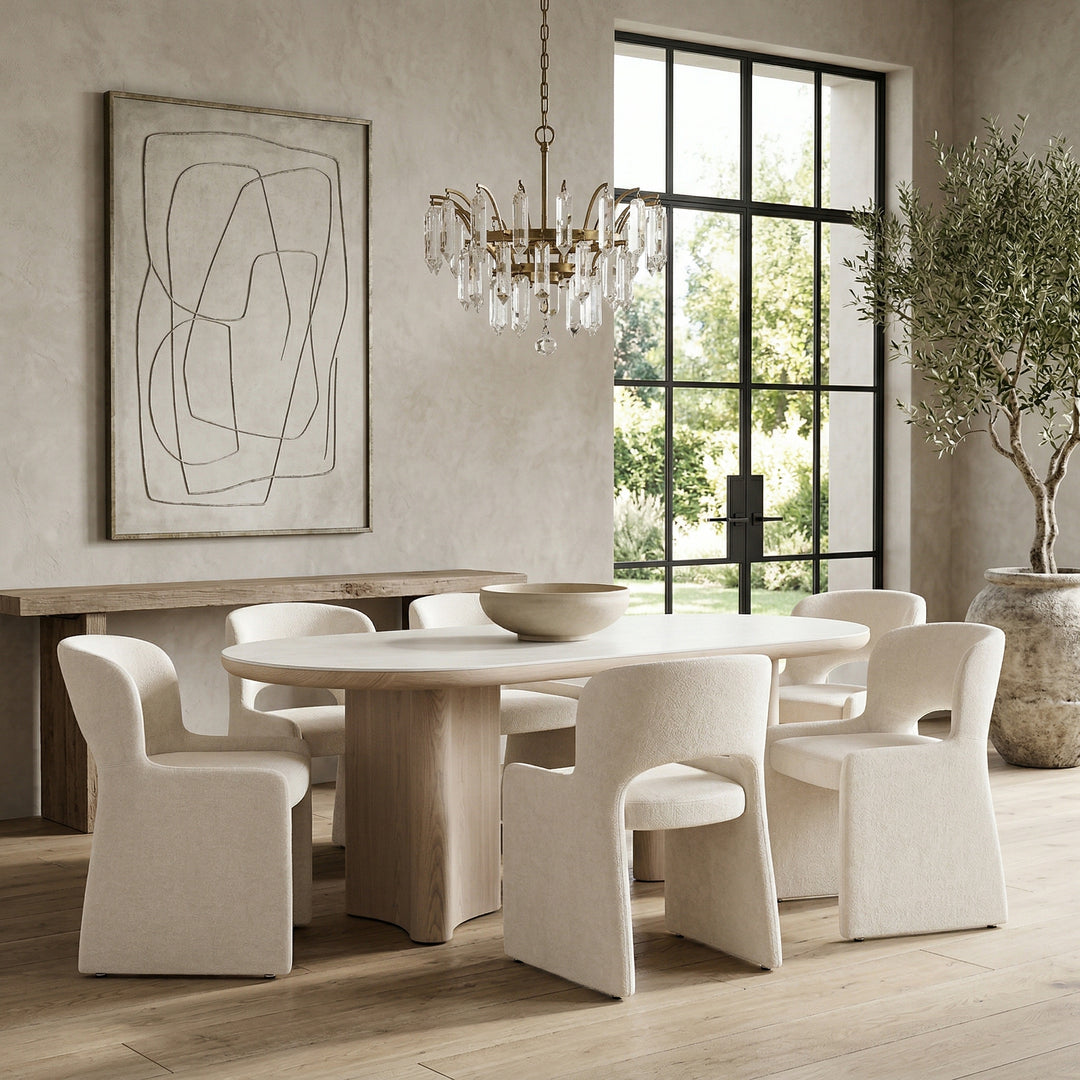 Light cream Amelia dining chair with sleek design, featuring a cushioned seat and modern wooden legs.