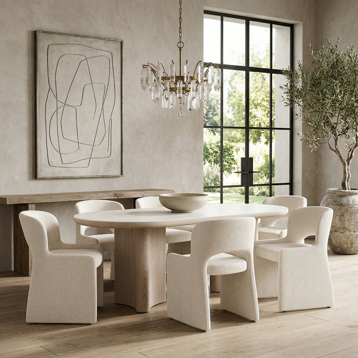 Light cream Amelia dining chair with sleek design, featuring a cushioned seat and modern wooden legs.