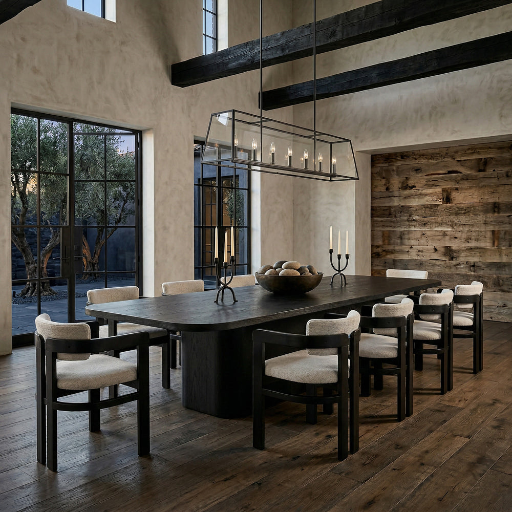 Black 3m Colonna dining table with sleek surface, shown with matching black dining chairs in a modern dining room setting.