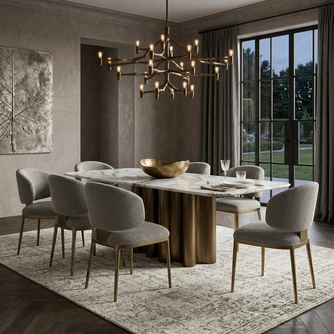 Elegant Regalia dining chair with plush upholstery and wooden legs, paired with a matching dining table in a luxurious setting.