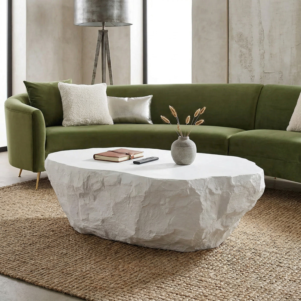 Ivory Roccia coffee table from the coffee tables collection, shown with a sofa in a modern living room setting.