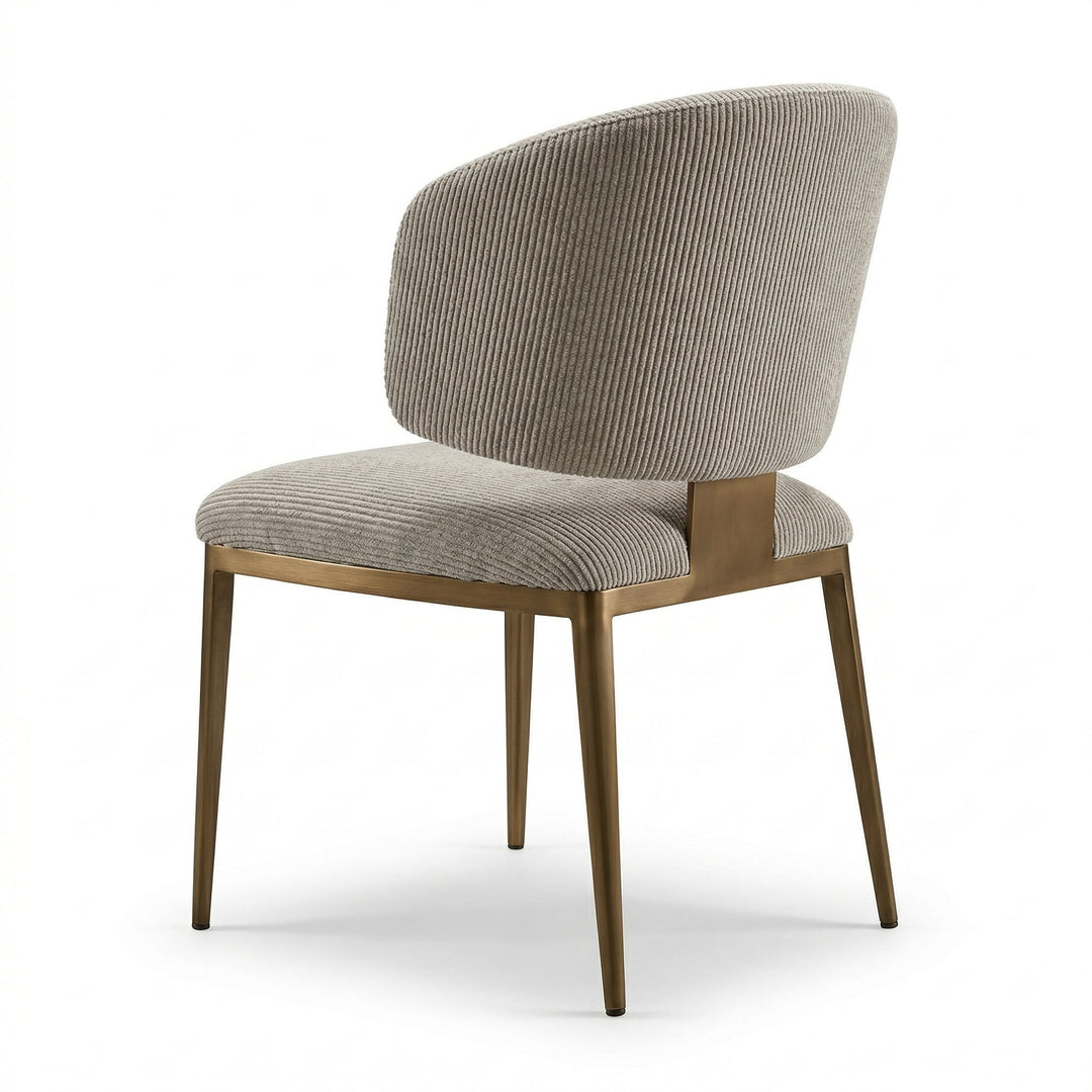 Silver metal frame dining chair with a curved banana-shaped seat and backrest, modern design for stylish dining spaces.