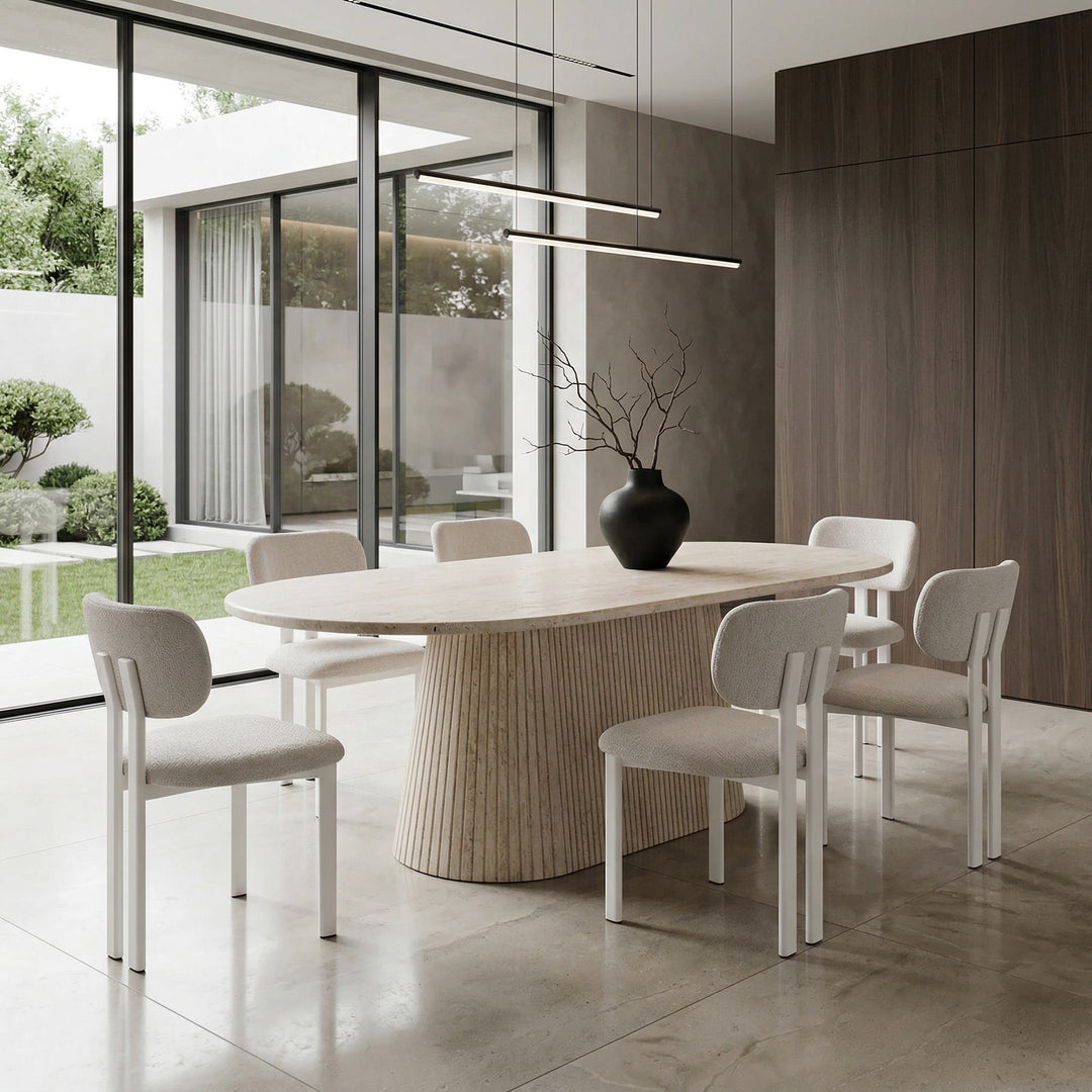 Beige textured Salvatini dining chair with modern design, shown beside a large travertine oval dining table, perfect for contemporary dining rooms.
