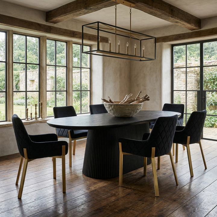Black oak Borelli oval dining table, 1.8m in length, showcasing a sleek design with a smooth surface and sturdy base.