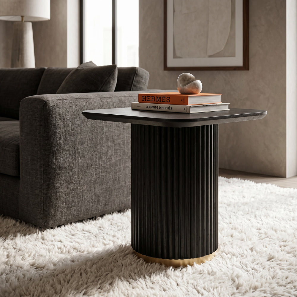 Black wood Mirabella side table with fluted legs and brushed gold accents, showcasing a sleek, modern design.