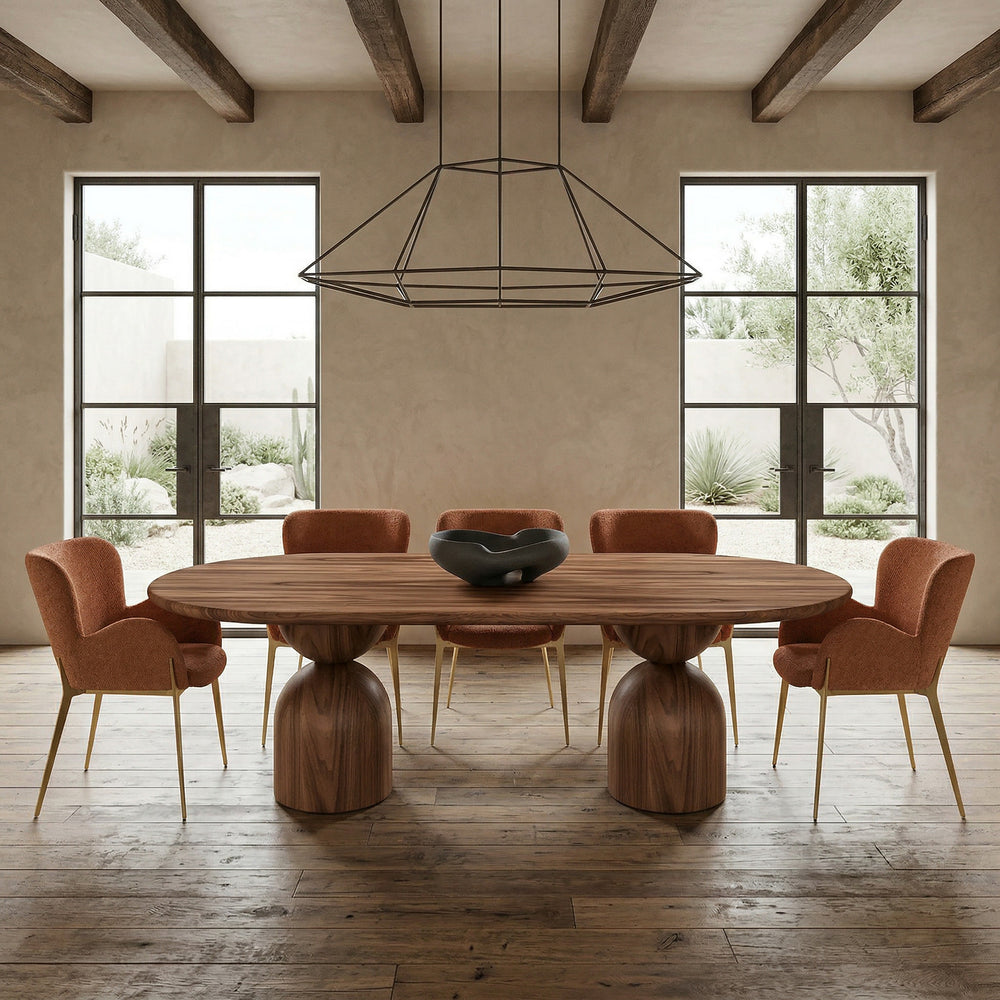 Burnt orange Lucia dining chair with sleek modern design, shown beside a walnut oval dining table in a contemporary dining setting.