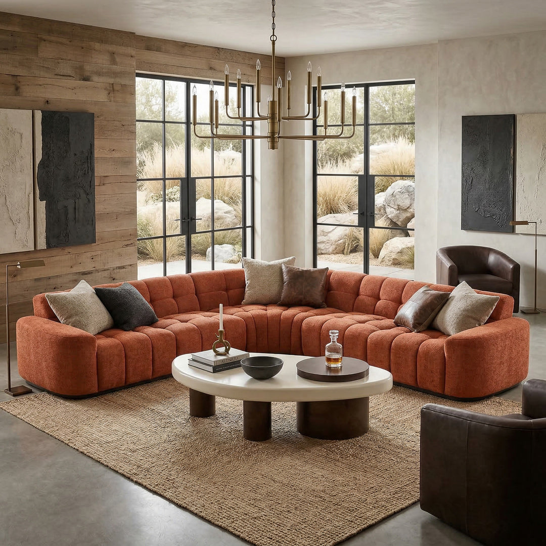 Rust-colored Adriano corner sofa in a modern living room setting, featuring plush cushions and sleek design.