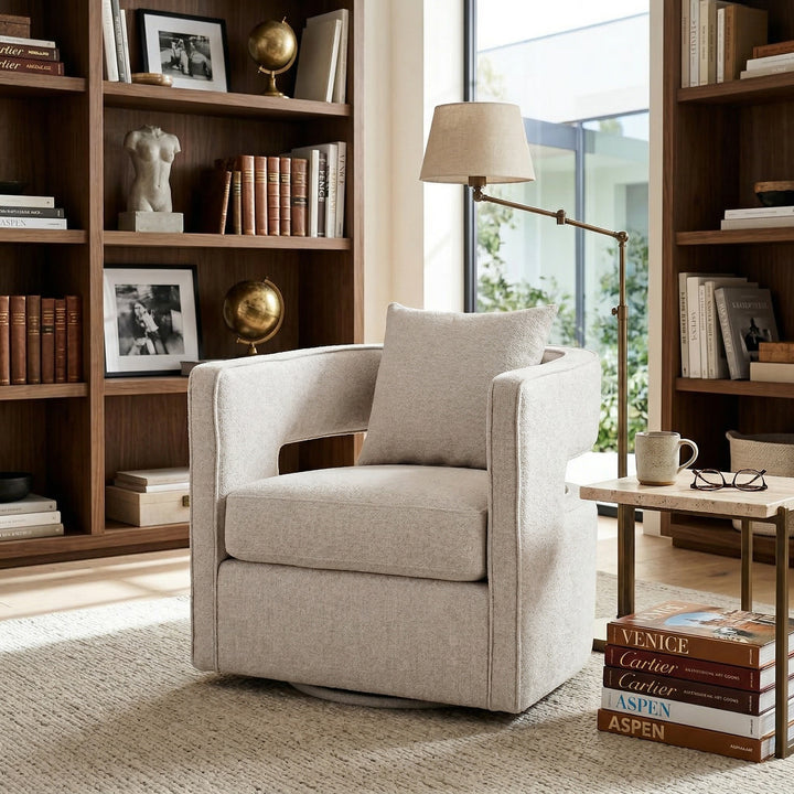 Beige Rhonda Swivel Chair in modern living room setting, featuring a rounded seat and sleek design for stylish comfort.