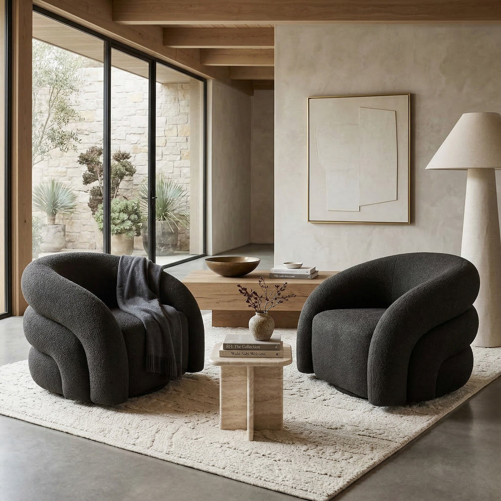 Black Ventosa Swivel Chair, modern occasional chair with a round base, in a contemporary living room setting.