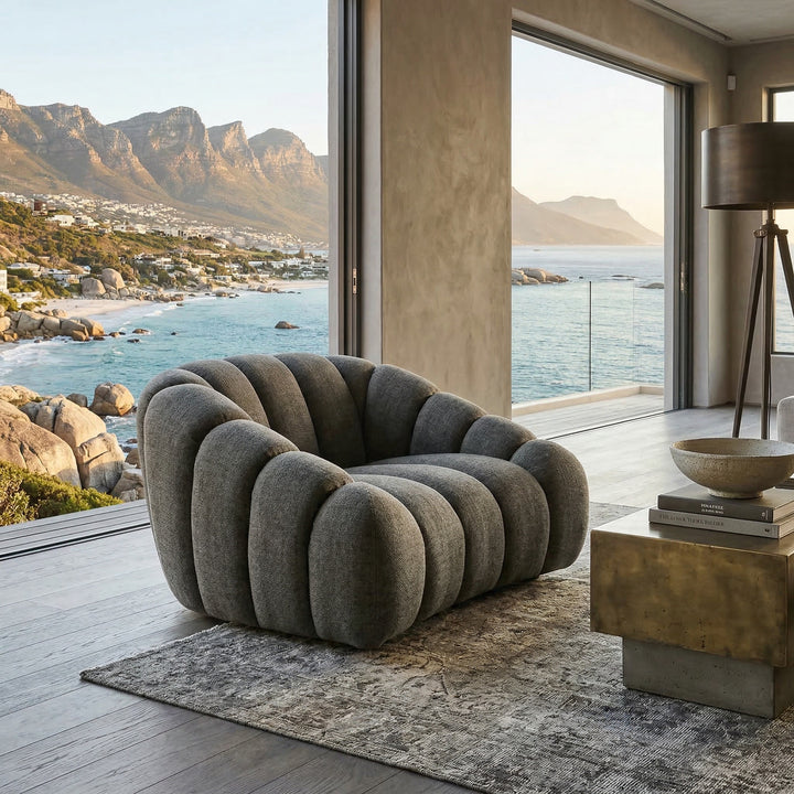 Hunter green Bubble 1 Seater sofa with modern design, featuring smooth curves and plush fabric for stylish comfort in a contemporary living space.