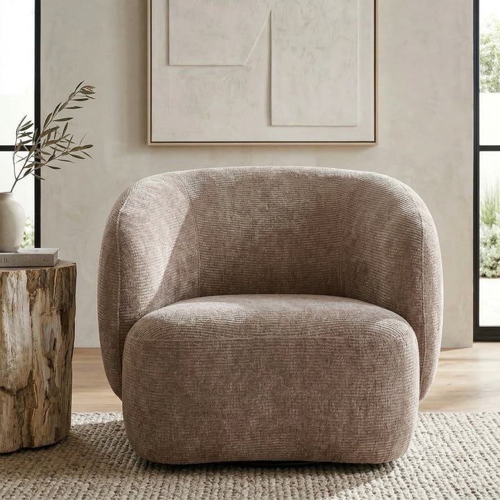 Textured mushroom-colored Puffy occasional chair with a rounded shape in a modern living room setting.