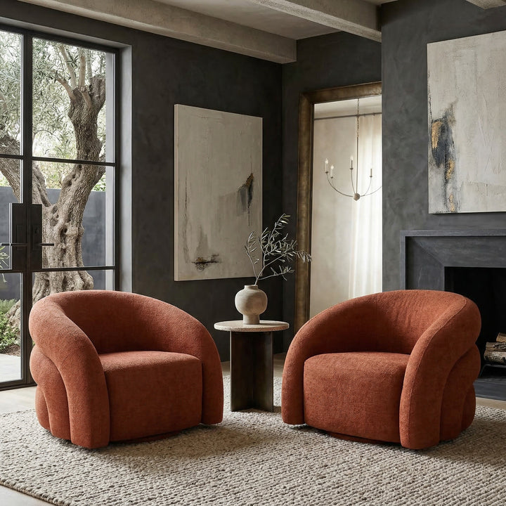 Rust-colored Ventosa swivel chair in modern living room, featuring a rounded design and comfortable seating.