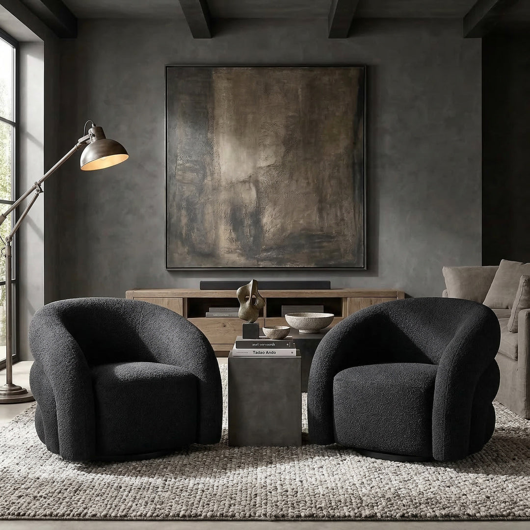 Black Ventosa Swivel Chair in a modern living room, featuring a sleek round seat and a swivel base for comfortable seating.