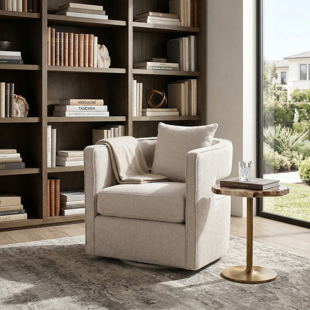 Beige Rhonda swivel chair with modern design, featuring a rounded backrest and cushioned seat in a contemporary living room setting.
