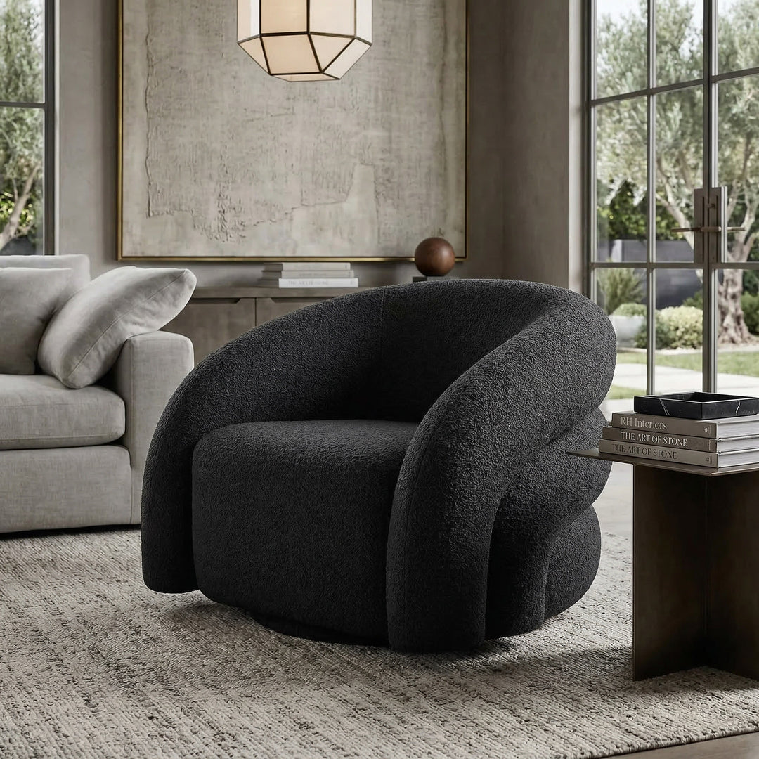 Black Ventosa Swivel Occasional Chair with a modern design, featuring a cushioned seat and swivel base in a contemporary living room setting.