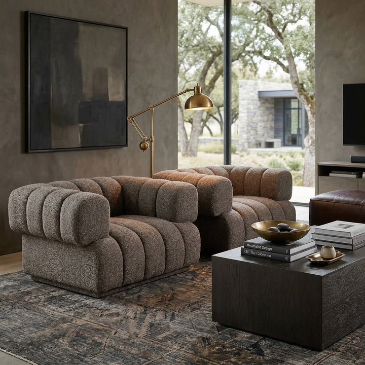 Modern Sardinia 4-seater sofa with sleek design and neutral fabric, situated in a contemporary living room setting.