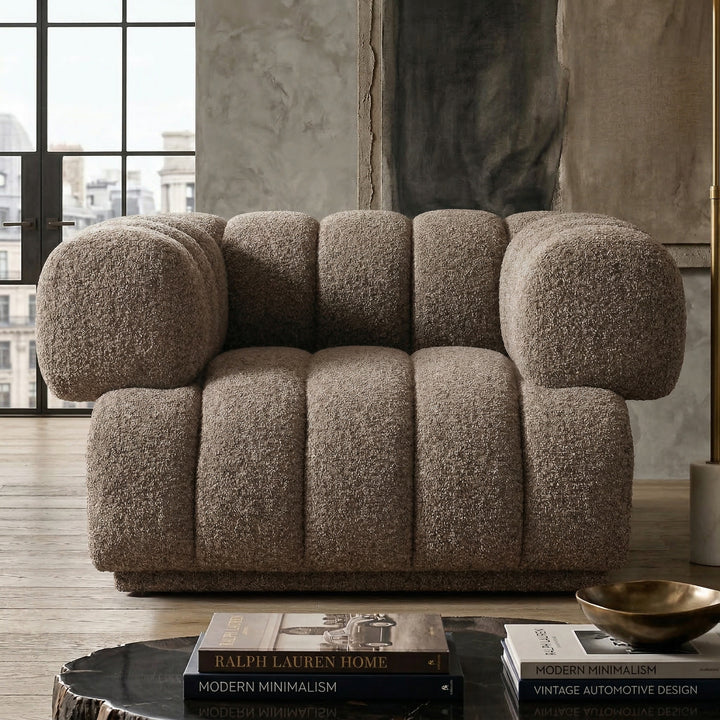 Modern Sardinia 4-seater sofa in neutral fabric with plush cushions in a contemporary living room setting.