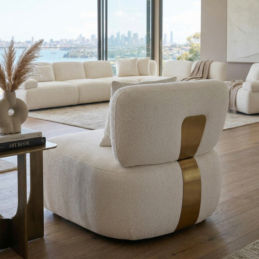Modern Status Chair occasional chair with a sleek design, featuring a rounded banana shape in a contemporary living room setting.