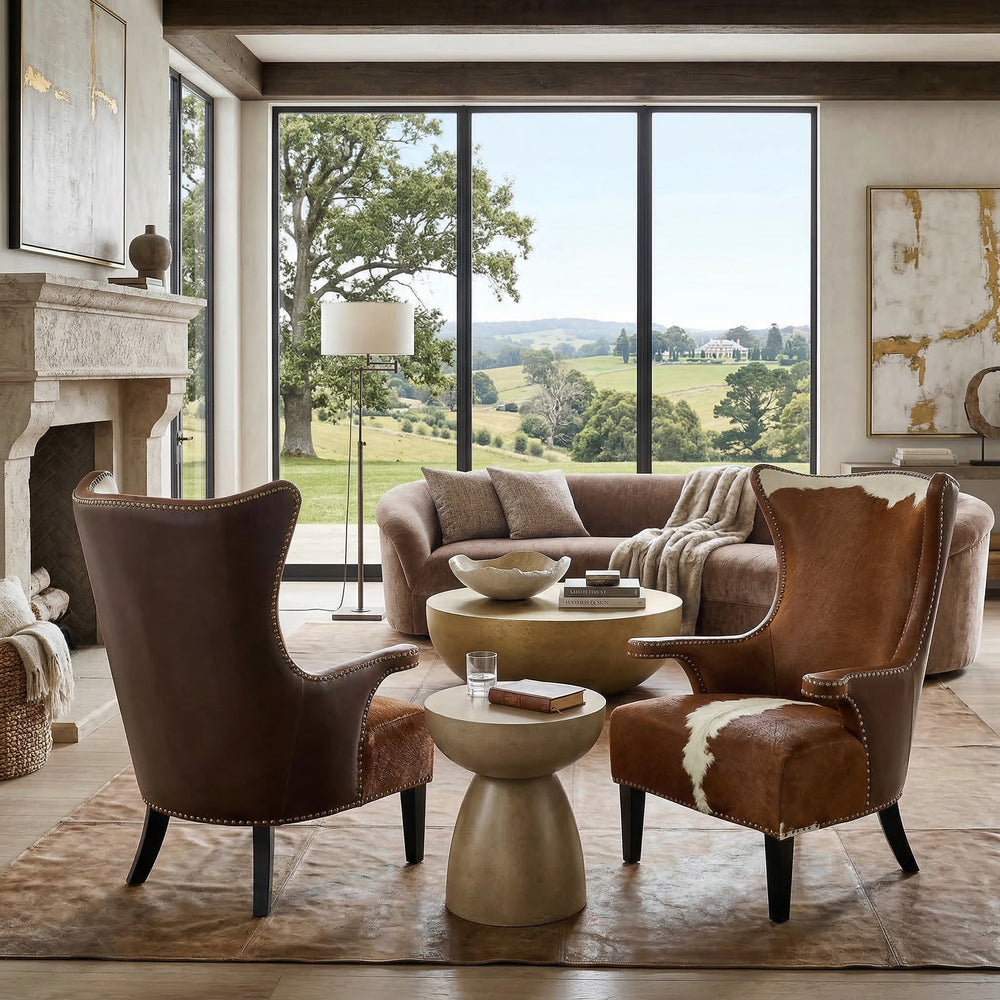 Brown cowhide Taurus occasional chair with a curved back and sleek design, perfect for stylish living room seating.