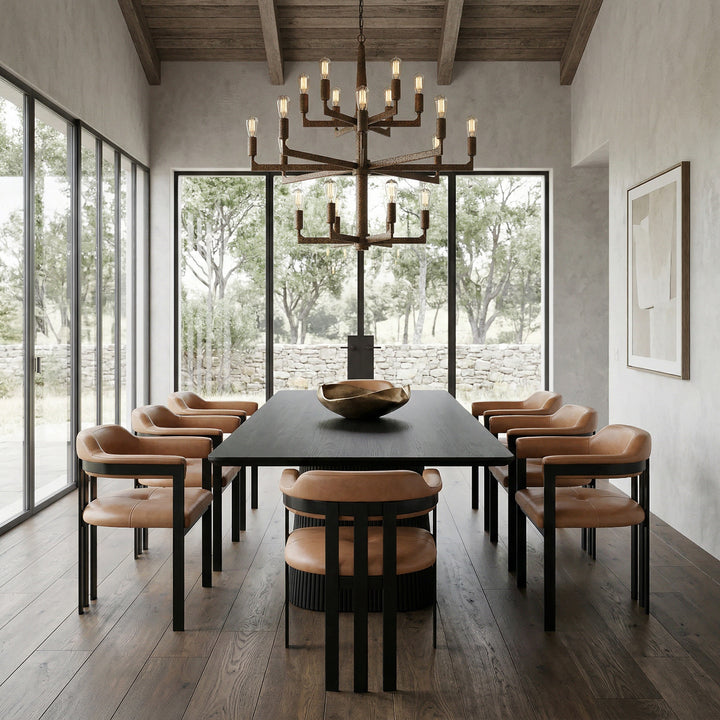 Giuseppe tan leather dining chair with a sleek design, shown next to a black oak rectangular dining table.