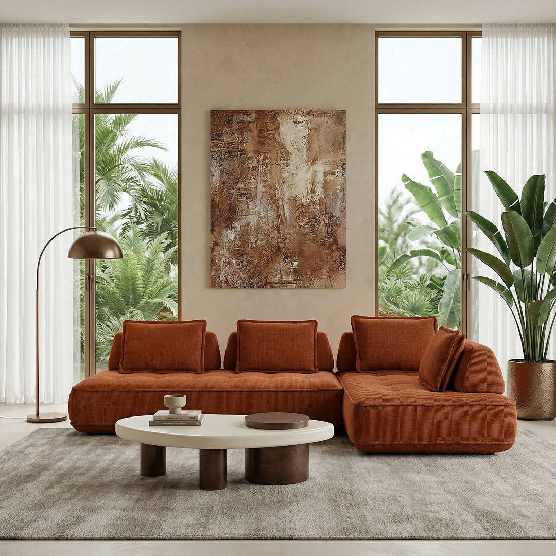 Photorealistic image of a contemporary living room featuring a cozy modular rust-colored sofa with plush cushions and modern design.