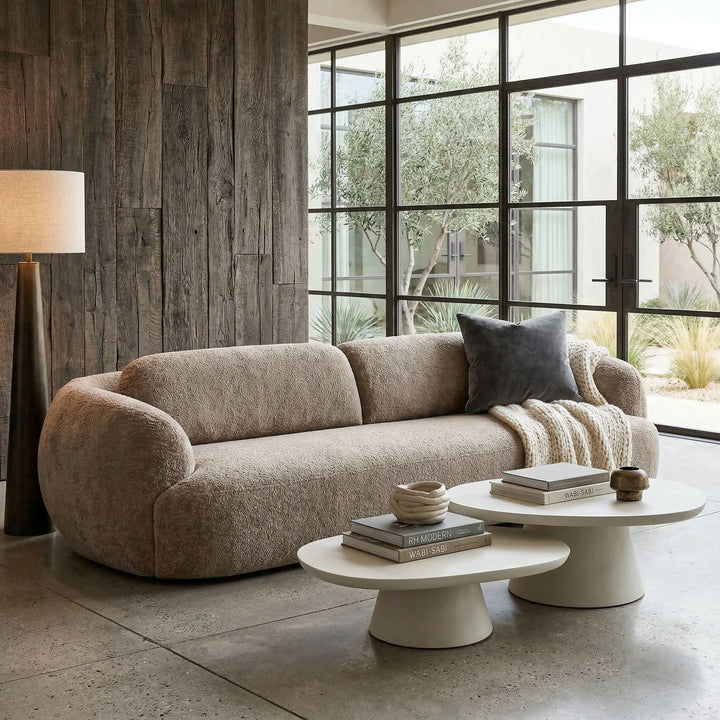 Modern Buffo sofa in a stylish living room with neutral tones and contemporary decor, showcasing its sleek design and comfortable seating.