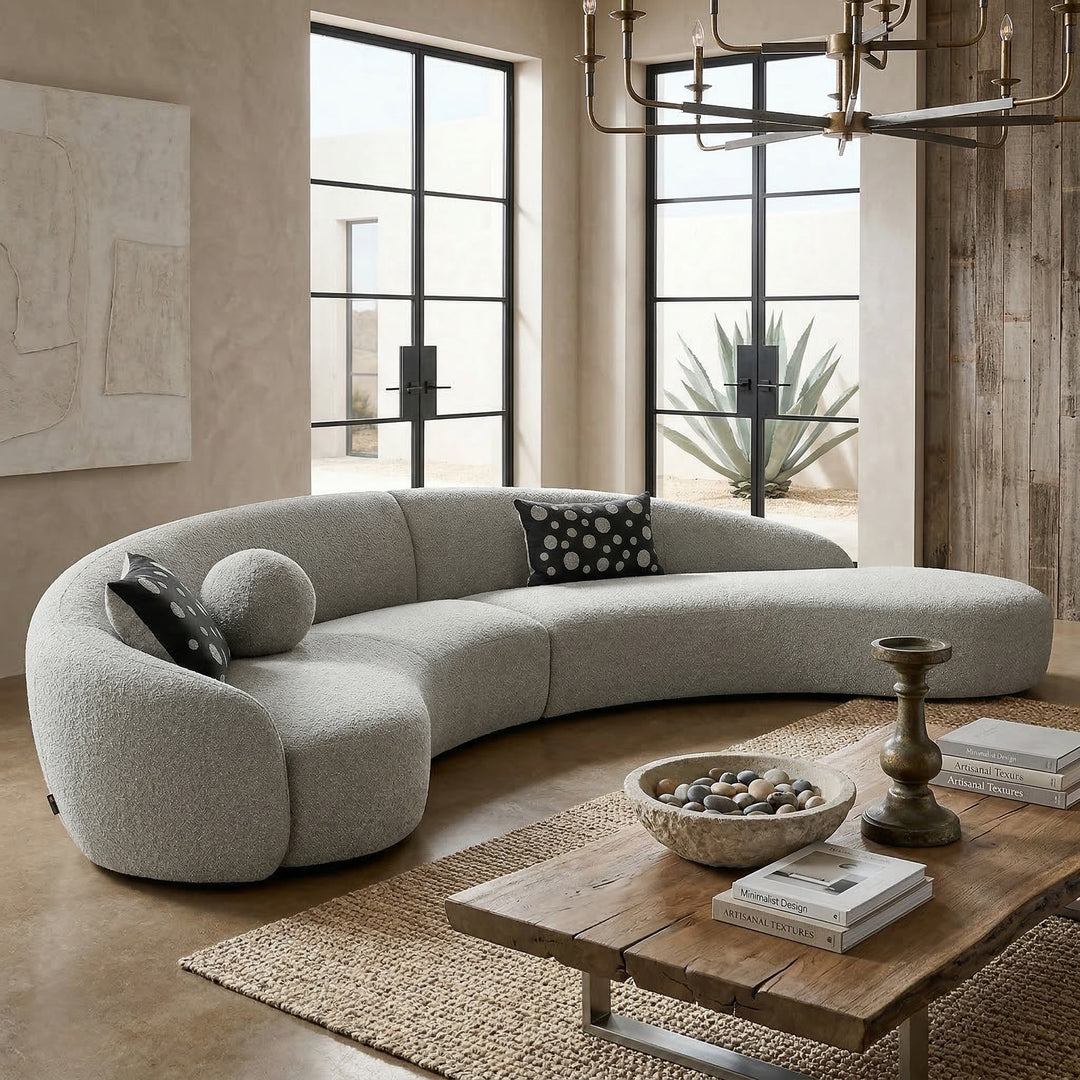 Grey boucle Mars sofa with plush cushions and modern design, showcased in a cozy living room setting.
