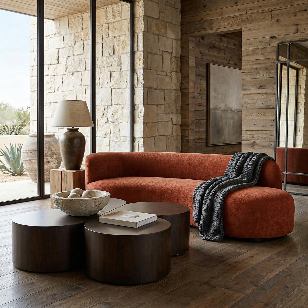 Rust-colored Fabrizio sofa with plush cushions and modern design, shown in a cozy living room setting.