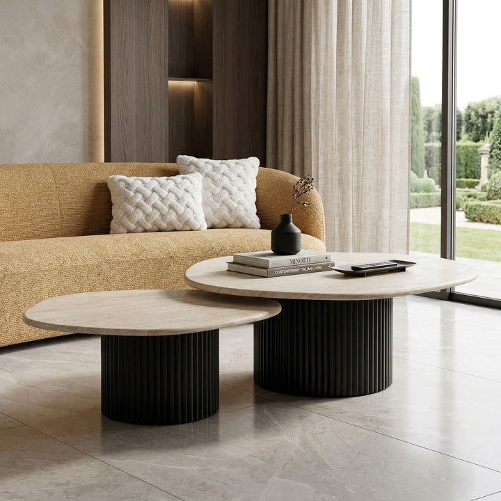 Set of two Noosa coffee tables with travertine tops, featuring modern design and sleek wooden legs, paired with a sofa.